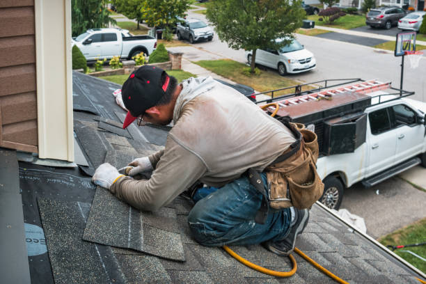 Professional Roofing technician working in Williston Park, NY